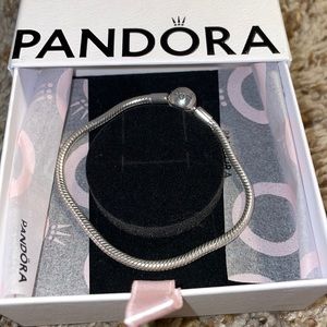 Pandora silver charm bracelet, silver bear with white heart and pacifier charm.